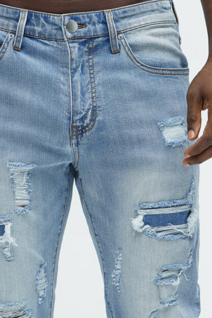 Jeans entallados rasgados estilo vintage - Image 4