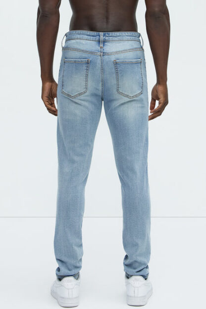 Jeans entallados rasgados estilo vintage - Image 5